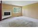 Bright living room boasting a cozy fireplace and natural light at 5177 Fairway Dr, Avon, IN 46123