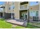View of the outdoor patio space on a two-story home with sliding glass doors to a balcony at 5177 Fairway Dr, Avon, IN 46123