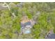 Aerial view of home with pool, deck, and wooded surroundings at 5190 Potters Pike, Indianapolis, IN 46234