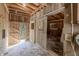 Interior view of a wooden barn featuring a sliding door and natural lighting at 5190 Potters Pike, Indianapolis, IN 46234