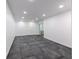 Spacious finished basement with recessed lighting and access to an outdoor space at 5190 Potters Pike, Indianapolis, IN 46234
