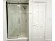 Recently updated bathroom with glass shower door, rain-style shower head and modern accents at 5190 Potters Pike, Indianapolis, IN 46234