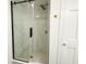 Modern bathroom with glass enclosed shower, rain-style shower head, and gold fixtures at 5190 Potters Pike, Indianapolis, IN 46234