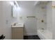 Modern bathroom with vanity, toilet, and tub-shower combo featuring designer tile and gold fixtures at 5190 Potters Pike, Indianapolis, IN 46234