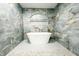 Tiled shower features a freestanding tub and a built-in niche at 5190 Potters Pike, Indianapolis, IN 46234