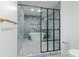 Contemporary bathroom featuring a soaking tub behind a framed glass shower enclosure at 5190 Potters Pike, Indianapolis, IN 46234