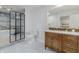 Bathroom featuring double vanity, tub, shower with black-framed glass enclosure at 5190 Potters Pike, Indianapolis, IN 46234