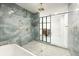 Bathroom featuring an open shower, luxury blue tiling, and gold fixtures at 5190 Potters Pike, Indianapolis, IN 46234