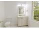 Bathroom with white vanity, modern toilet and window at 5190 Potters Pike, Indianapolis, IN 46234