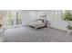 Bright bedroom features french doors, neutral walls, and plush carpeting at 5190 Potters Pike, Indianapolis, IN 46234