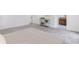 Bedroom featuring plush gray carpet, view into ensuite bathroom, and view of hallway at 5190 Potters Pike, Indianapolis, IN 46234