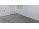 Cozy bedroom with a large window, closet, and plush carpet flooring at 5190 Potters Pike, Indianapolis, IN 46234