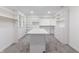 Spacious walk-in closet with custom shelving, drawers, and central island with quartz countertop at 5190 Potters Pike, Indianapolis, IN 46234