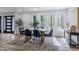Dining room featuring modern finishes, hardwood floors, and a large window showcasing natural light at 5190 Potters Pike, Indianapolis, IN 46234