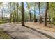 Picturesque home nestled among mature trees, offering privacy and charm at 5190 Potters Pike, Indianapolis, IN 46234