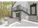 Striking two-story home showcasing a decorative iron staircase leading to an upper level balcony at 5190 Potters Pike, Indianapolis, IN 46234