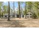 Charming front exterior of a two-story home with black and white paint and mature trees at 5190 Potters Pike, Indianapolis, IN 46234