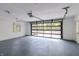 Clean garage interior featuring a clear garage door and a basketball hoop, offering a versatile space at 5190 Potters Pike, Indianapolis, IN 46234