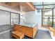 Relaxing hot tub in sunroom with wood ceiling and bright, natural light at 5190 Potters Pike, Indianapolis, IN 46234