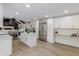 An expansive kitchen with an island, stainless steel appliances and white cabinets at 5190 Potters Pike, Indianapolis, IN 46234