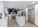 Bright kitchen with stainless steel appliances, white cabinets, and an island at 5190 Potters Pike, Indianapolis, IN 46234