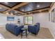 Stylish finished basement with recessed lights, exposed beams and contemporary furniture at 5190 Potters Pike, Indianapolis, IN 46234