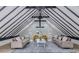 Bright living room boasting vaulted ceilings, modern ceiling fan, neutral furniture and sun-filled windows at 5190 Potters Pike, Indianapolis, IN 46234