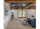 Finished basement area with a cozy seating arrangement and sliding doors to the exterior at 5190 Potters Pike, Indianapolis, IN 46234