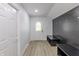Mud room featuring a decorative front door, white walls, dark wood paneling, and integrated bench seating at 5190 Potters Pike, Indianapolis, IN 46234