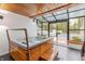 Sunroom-enclosed spa features brick accent wall, wood panels and tons of natural light at 5190 Potters Pike, Indianapolis, IN 46234