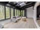 Sunroom featuring plenty of natural light, neutral tones, and wood floors at 5190 Potters Pike, Indianapolis, IN 46234