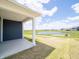 Back patio with a view of the lake, community, and blue skies at 5204 Cartland Dr, Indianapolis, IN 46239