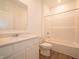 Pristine bathroom with a white vanity, a light countertop and a clean tub-shower combo at 5204 Cartland Dr, Indianapolis, IN 46239