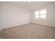 Bedroom features a neutral carpet and large window at 5204 Cartland Dr, Indianapolis, IN 46239