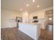 Kitchen with a central island, stainless steel appliances, and bright lighting at 5204 Cartland Dr, Indianapolis, IN 46239