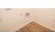 Bright laundry area with hookups and outlets, complemented by wood-look flooring at 5204 Cartland Dr, Indianapolis, IN 46239