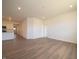 Open living area with laminate flooring with kitchen in background at 5204 Cartland Dr, Indianapolis, IN 46239