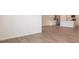 Spacious living area with laminate flooring flowing into the kitchen area at 5204 Cartland Dr, Indianapolis, IN 46239