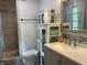 Stylish bathroom featuring a large mirror, modern vanity, and tiled shower at 5282 W Blue Bell Dr, New Palestine, IN 46163