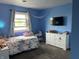 Charming bedroom with ample natural light, featuring a cozy bed and dresser at 5282 W Blue Bell Dr, New Palestine, IN 46163