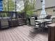 Spacious deck with outdoor seating, grill, and access to the backyard at 5282 W Blue Bell Dr, New Palestine, IN 46163