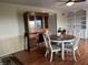 Dining room with hardwood floors, table with chairs, and a built-in hutch at 5282 W Blue Bell Dr, New Palestine, IN 46163