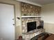 Cozy fireplace with stone surround with white mantle detail in the living room at 5282 W Blue Bell Dr, New Palestine, IN 46163