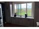 Kitchen features a coffee bar area with sleek gray cabinets and an exterior view at 5282 W Blue Bell Dr, New Palestine, IN 46163