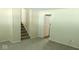 Finished basement featuring neutral carpet, a staircase, and ample space for Gathering activities at 5415 Wagon Wheel Trl, Indianapolis, IN 46237