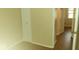 Bedroom with view toward hallway has standard closet, paint and wood flooring at 5415 Wagon Wheel Trl, Indianapolis, IN 46237