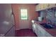 Well-lit kitchen featuring tiled backsplash, modern fixtures, and ample counter space at 5415 Wagon Wheel Trl, Indianapolis, IN 46237