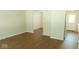 Bright living room featuring hard surface floors and a doorway leading to the kitchen at 5415 Wagon Wheel Trl, Indianapolis, IN 46237