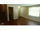 Spacious living area with a staircase, ample natural light, and neutral paint at 5415 Wagon Wheel Trl, Indianapolis, IN 46237