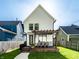 Backyard featuring a wooden deck with a pergola, outdoor seating, grill, manicured lawn, and modern white siding at 544 N Beville Ave, Indianapolis, IN 46201